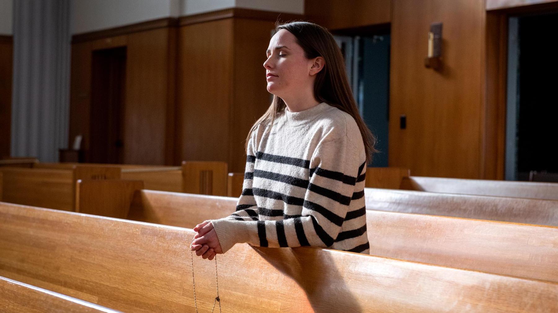 Allison praying at the Cathedral